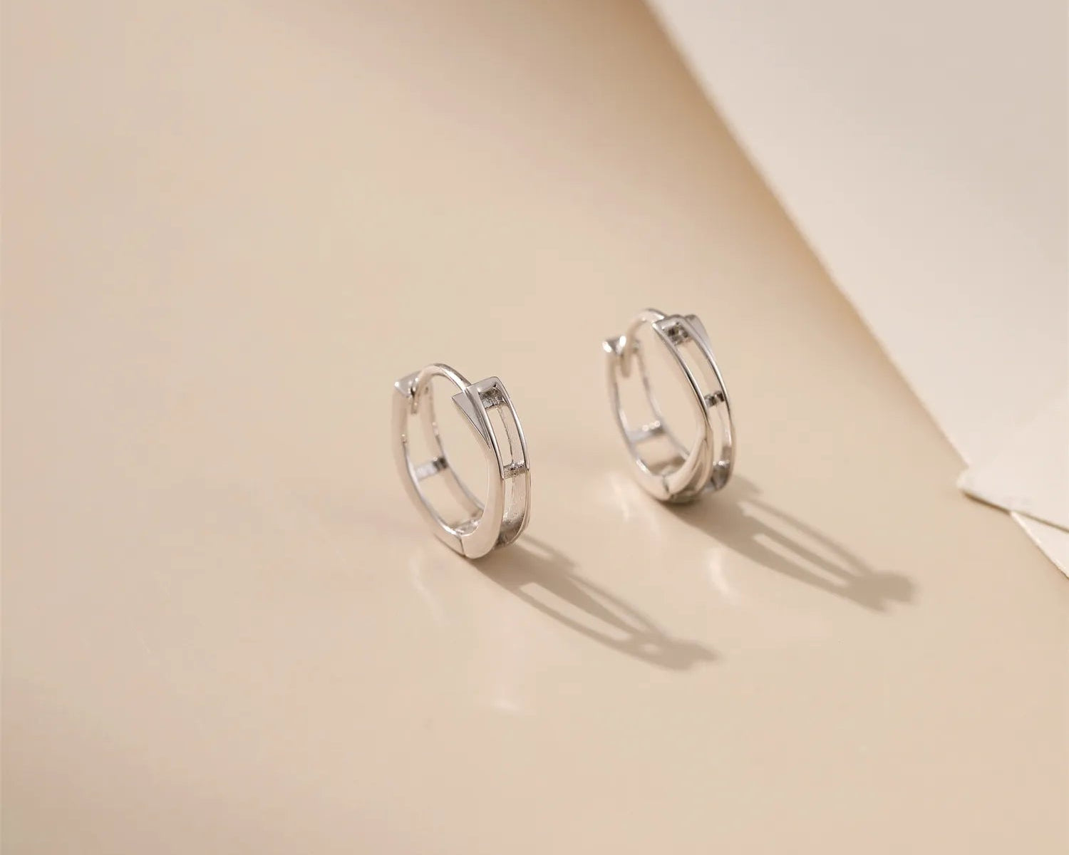 Crossed Circle Silver Hoops