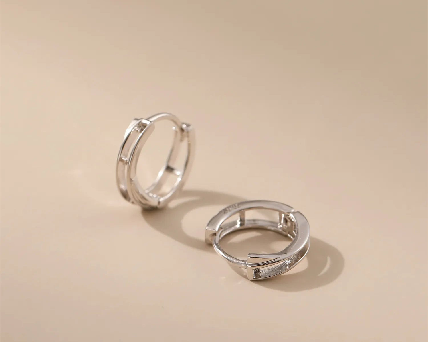 Crossed Circle Silver Hoops