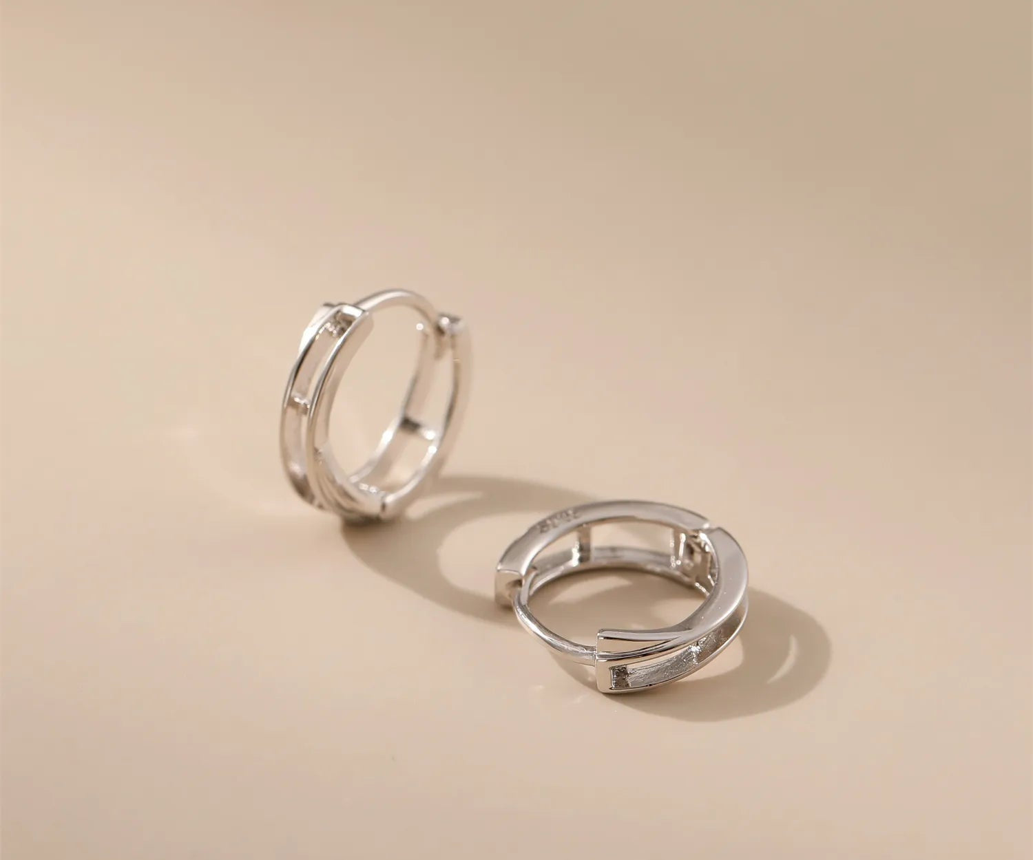 Crossed Circle Silver Hoops